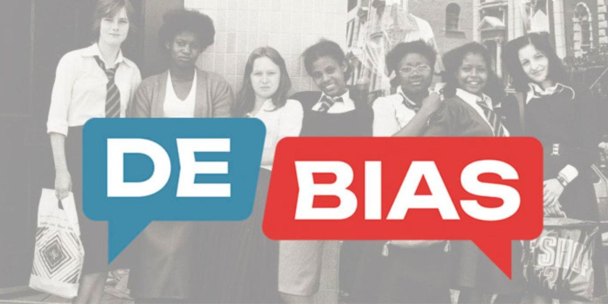 DE-BIAS logo imposed over schoolgirls stood in a line