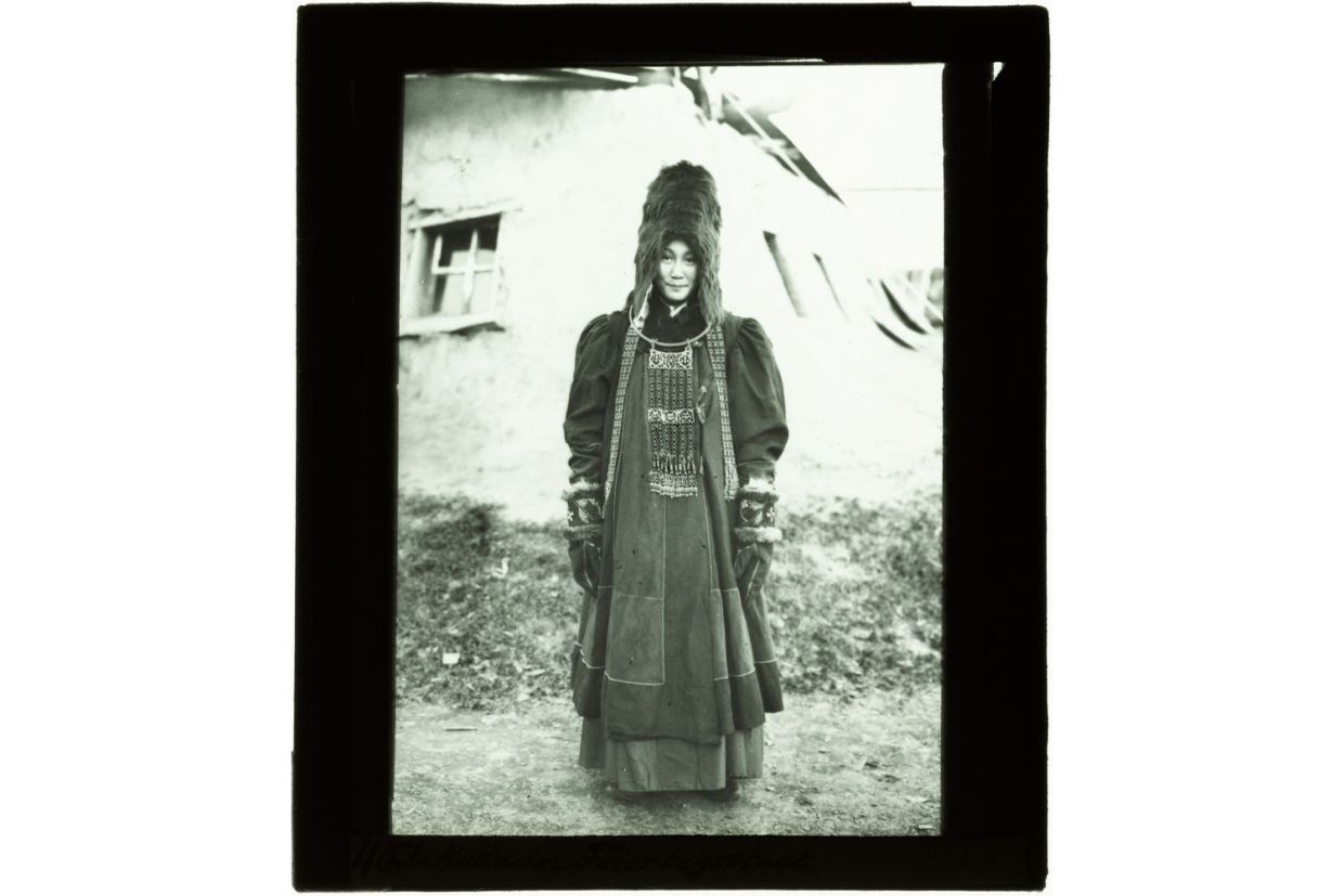 A photograph of Sakha (Yakut) woman in a traditional Sakha dress and accessories taken in 1908
