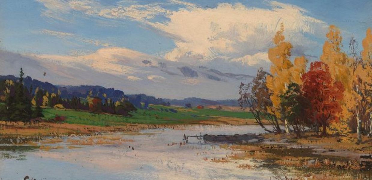 An autumn landscape showing a wide, flooded river, trees with orange and yellow leaves and a sky with two large clouds