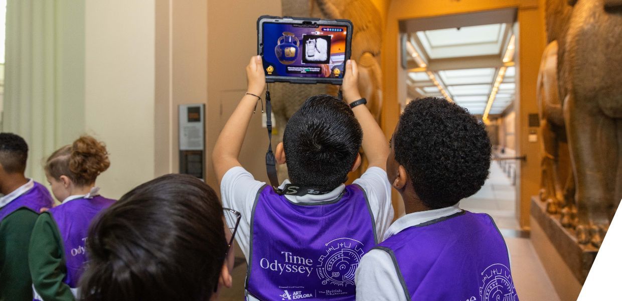 Children use a tablet with AR to explore ancient artifacts at the British Museum