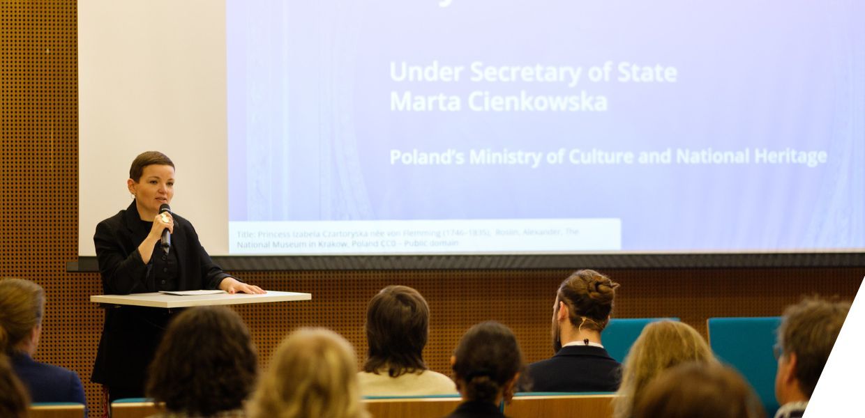 Photograph of Poland’s Under Secretary of State, Marta Cienkowska giving a speech